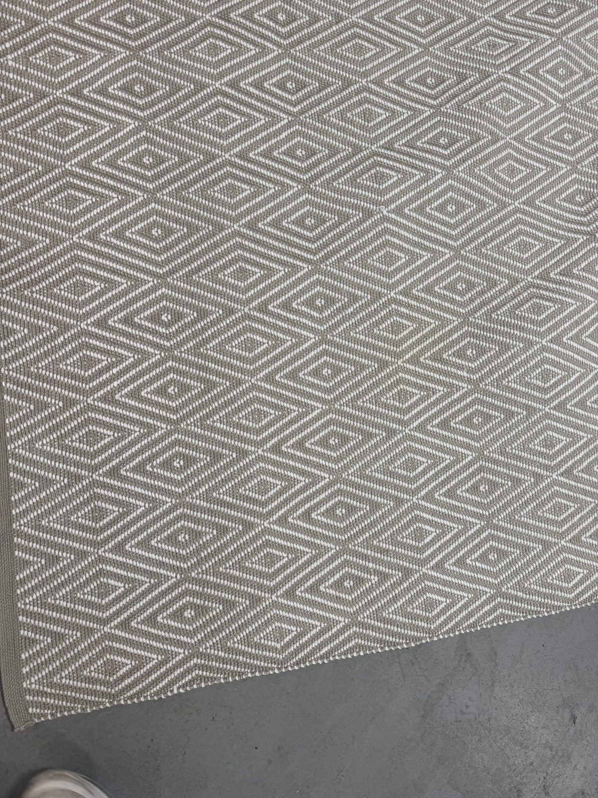 Close-up of clean diamond flatweave pattern after stain removal