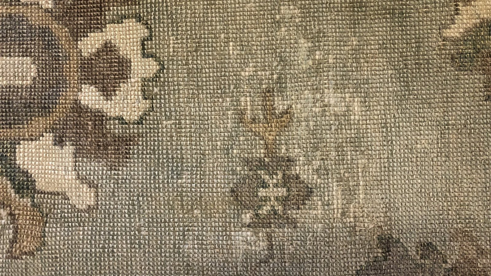 The reverse of a hand-knotted rug, knots and foundation threads clearly visible